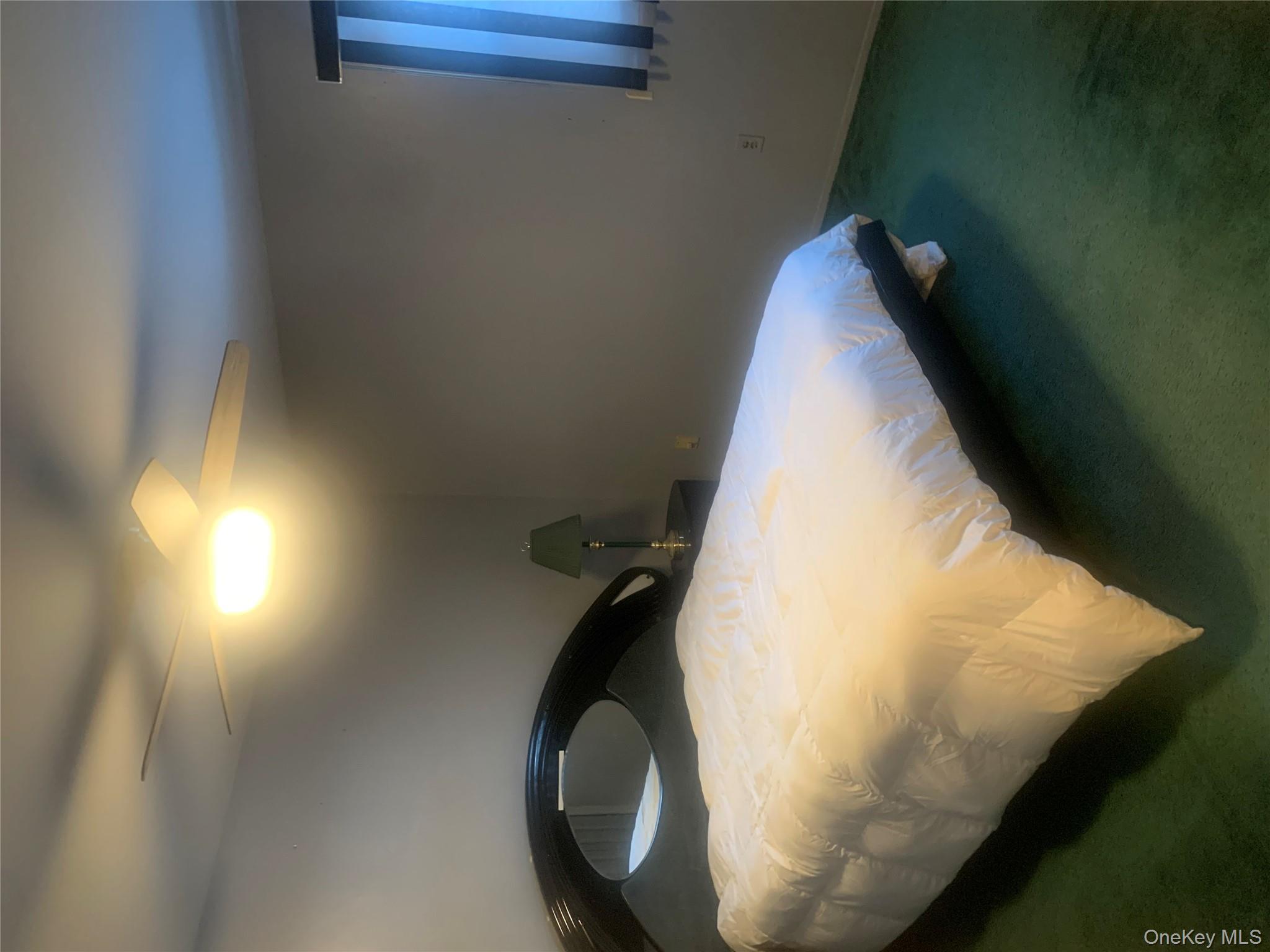 8 Autumn Lane Stony Point, NY 10980 - Photo 16 of 40 a bed sitting in a bedroom next to a window