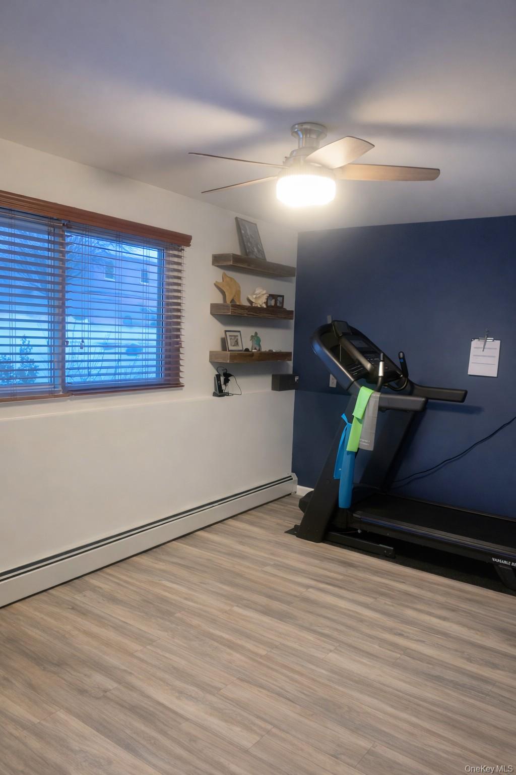 8 Autumn Lane Stony Point, NY 10980 - Photo 27 of 40 a room with wooden floor and furniture