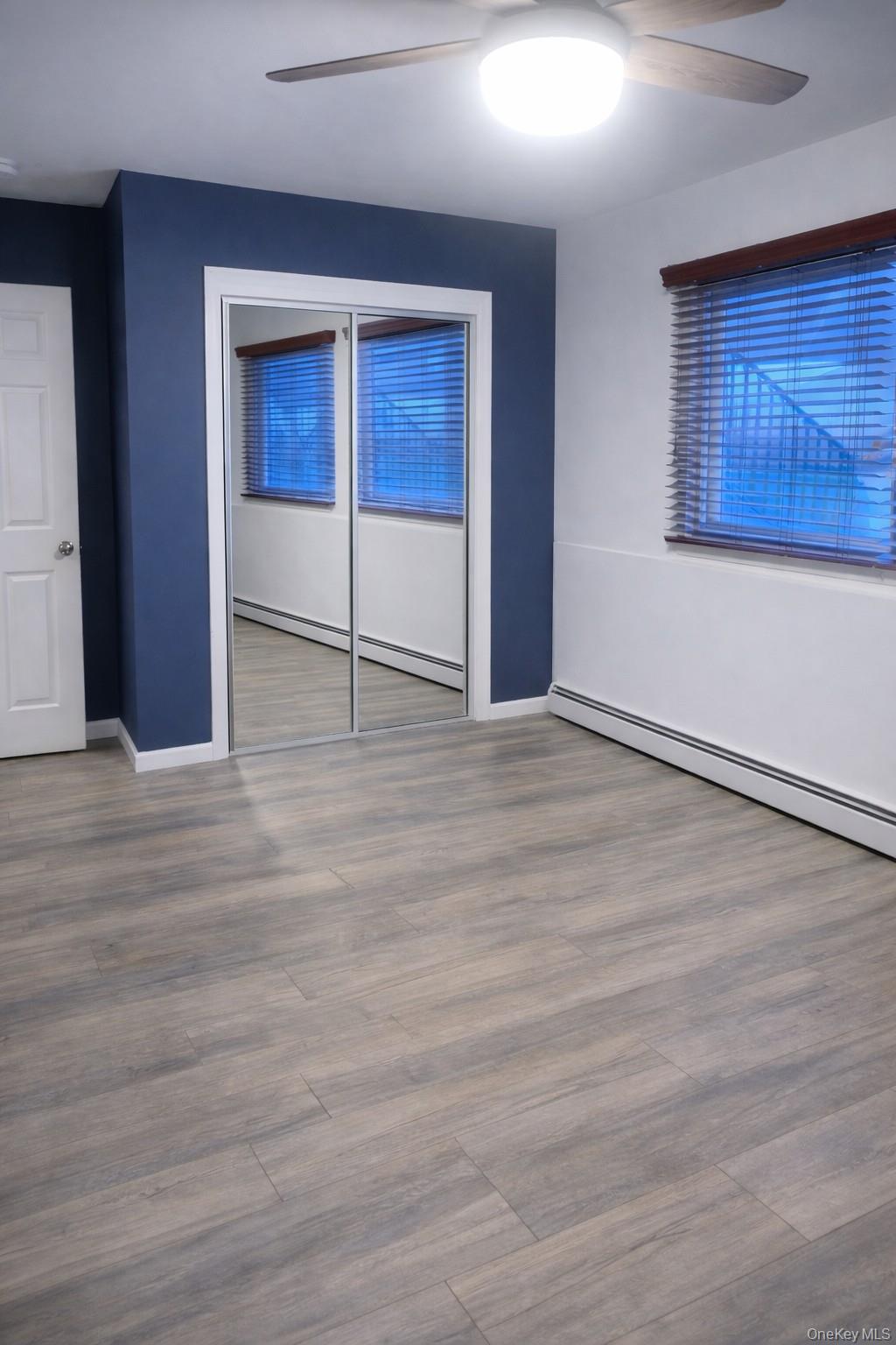 8 Autumn Lane Stony Point, NY 10980 - Photo 28 of 40 an empty room with wooden floor and windows