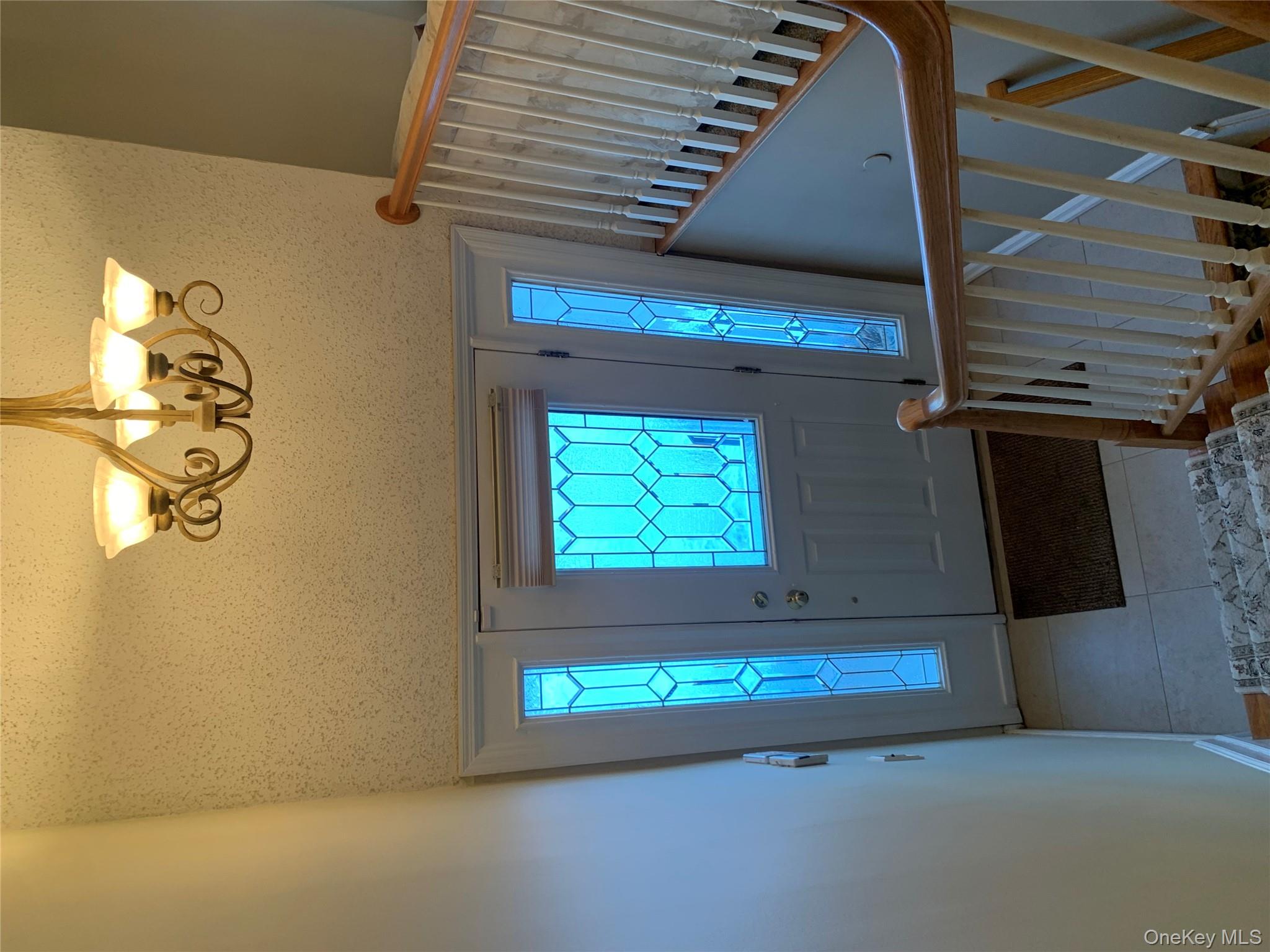 8 Autumn Lane Stony Point, NY 10980 - Photo 3 of 40 a view of a hallway with windows