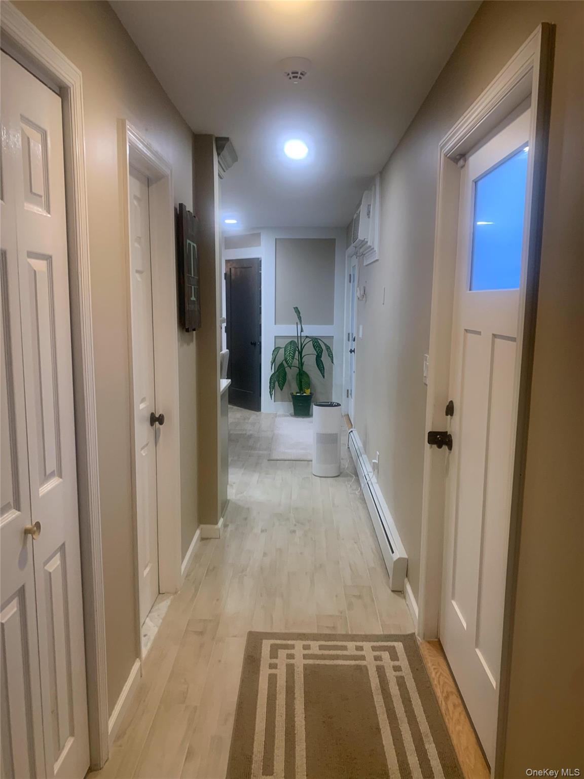8 Autumn Lane Stony Point, NY 10980 - Photo 31 of 40 a view of a hallway with wooden floor