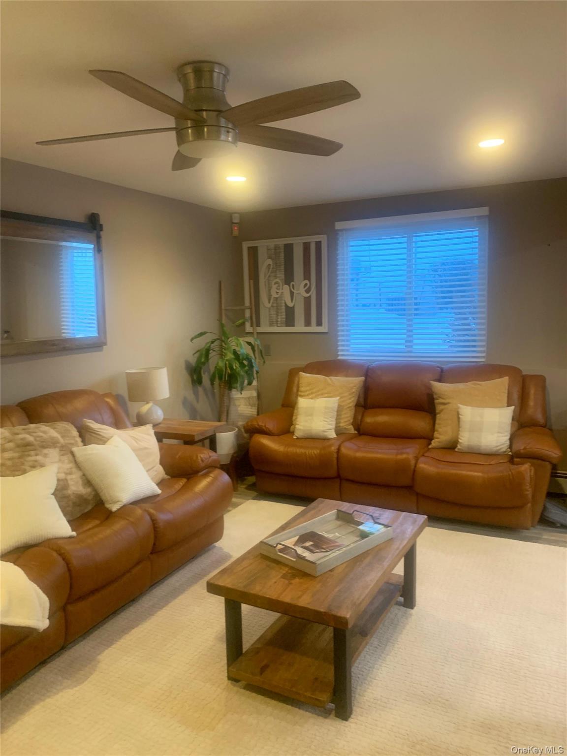 8 Autumn Lane Stony Point, NY 10980 - Photo 36 of 40 a living room with furniture and a chandelier