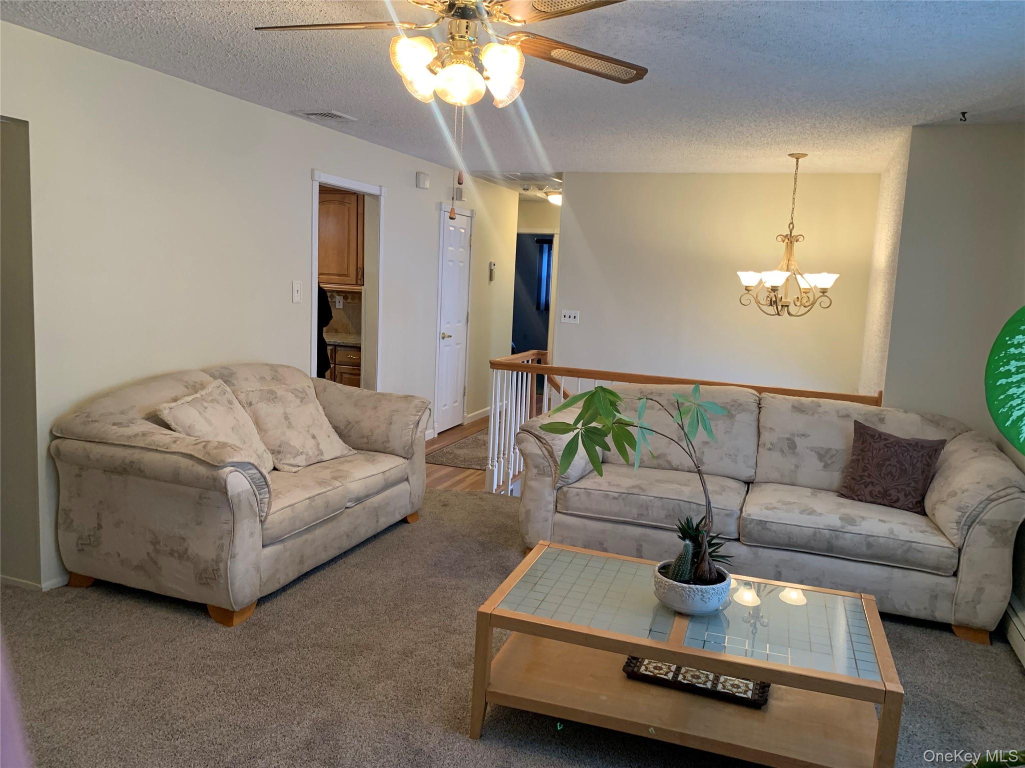 8 Autumn Lane Stony Point, NY 10980 - Photo 8 of 40 a living room with furniture and a chandelier
