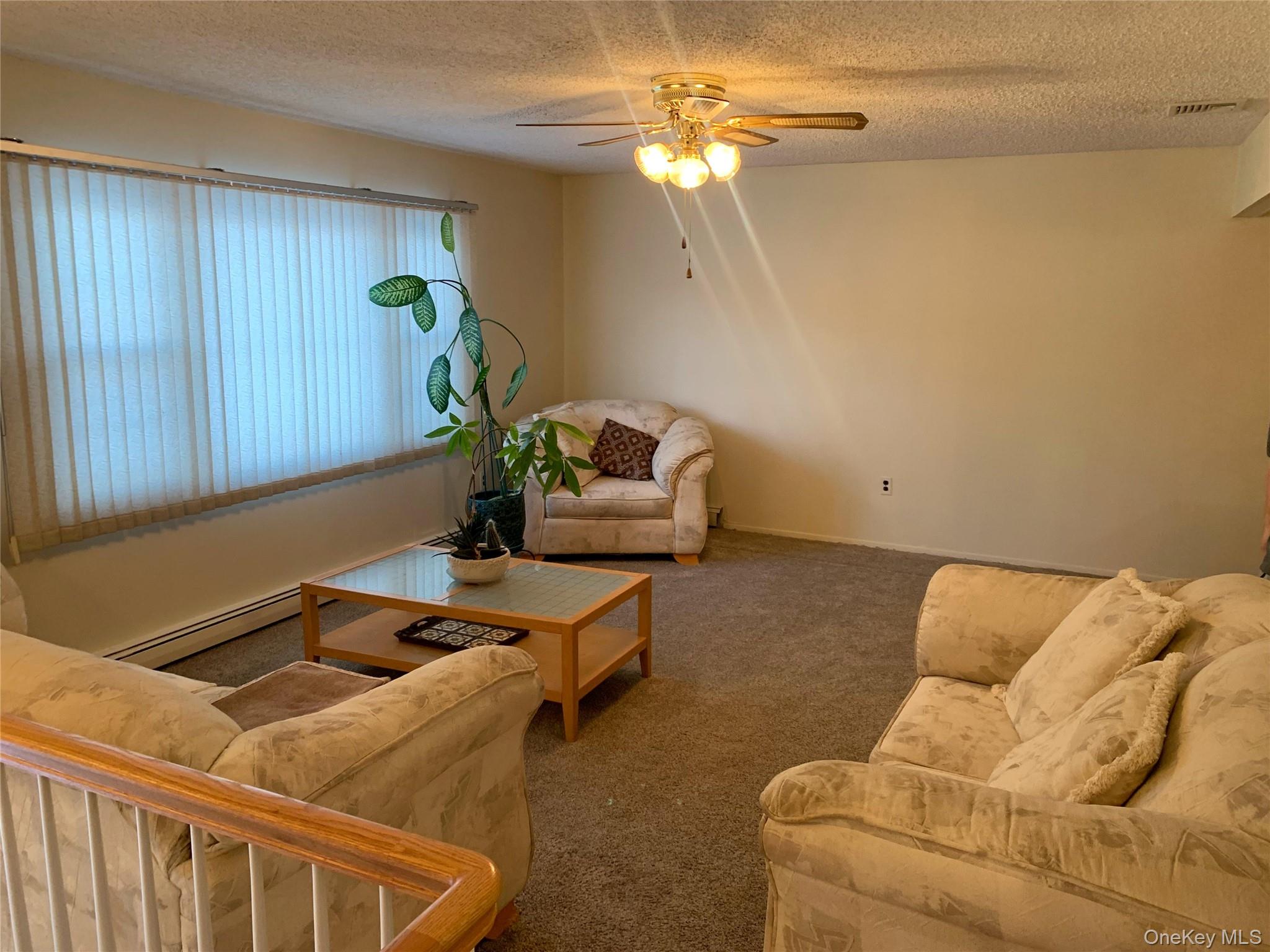 8 Autumn Lane Stony Point, NY 10980 - Photo 9 of 40 a room with furniture and a chandelier