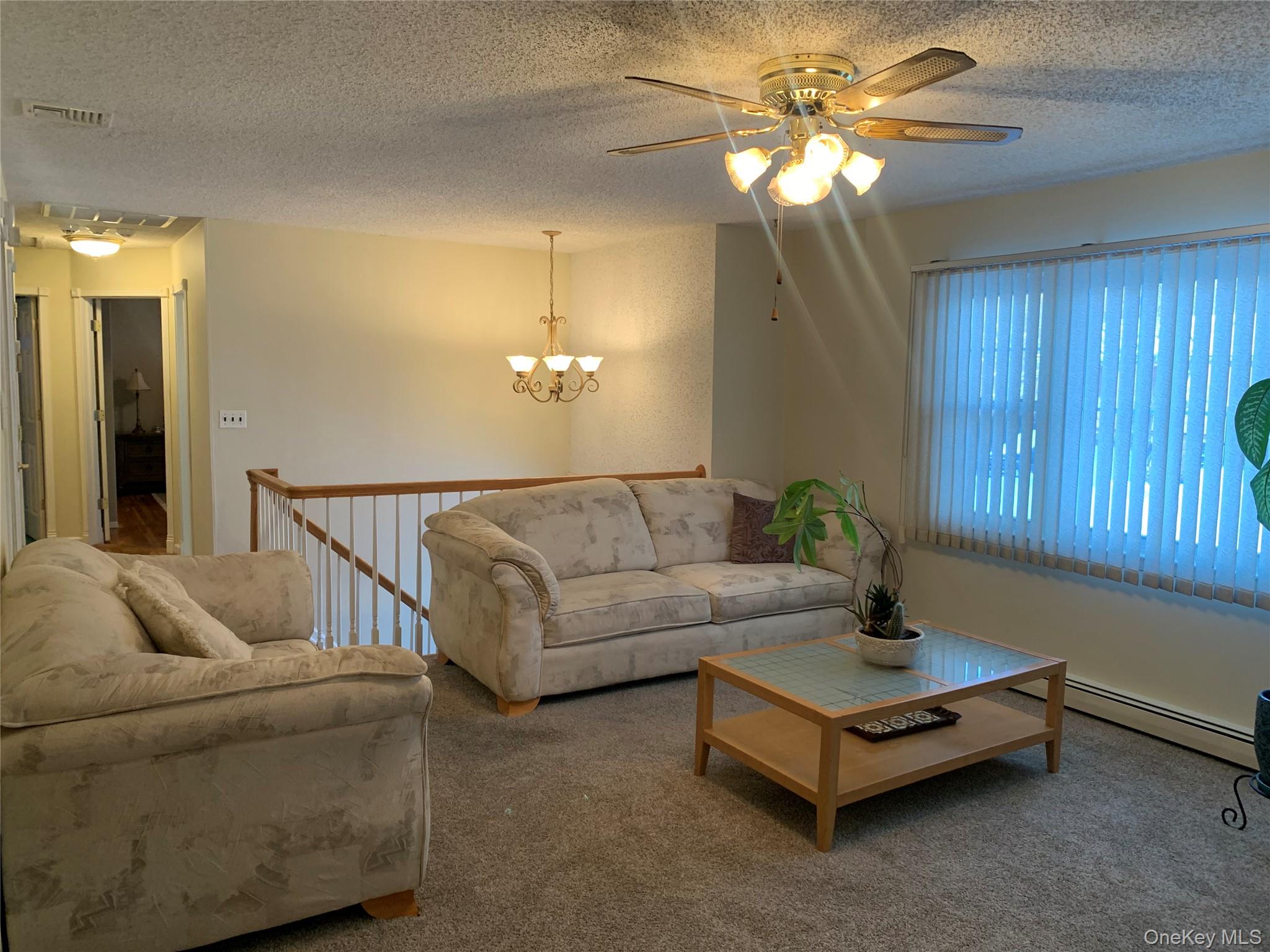 8 Autumn Lane Stony Point, NY 10980 - Photo 10 of 40 a living room with furniture and a chandelier