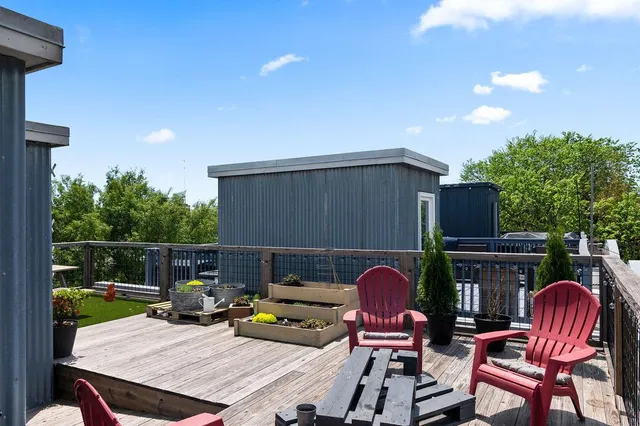 a view of a chairs and table in patio