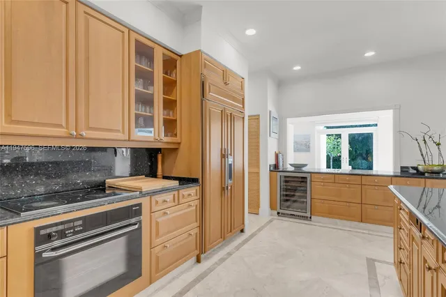 a kitchen with a stove and a refrigerator