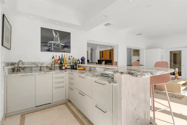 a kitchen with cabinets a sink and appliances