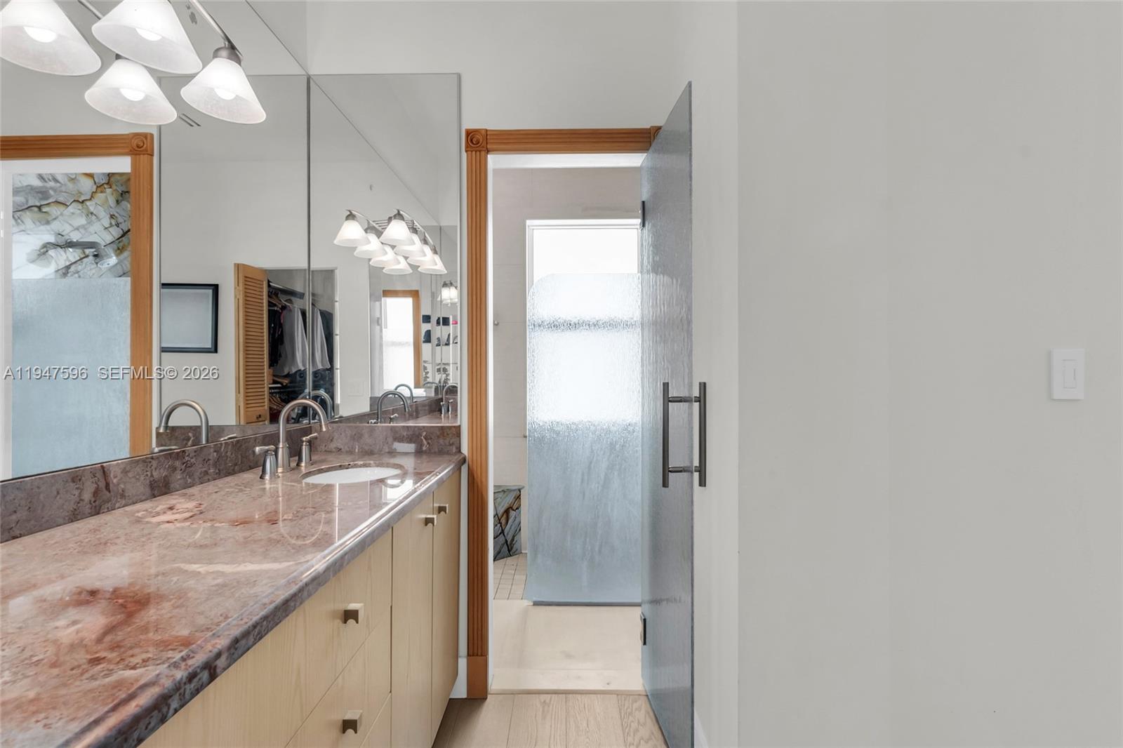 5794 Southwest 76th Terrace South Miami, FL 33143 - Photo 18 of 28 a bathroom with a granite countertop sink and a mirror