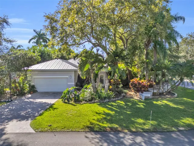 a backyard of a house with outdoor seating