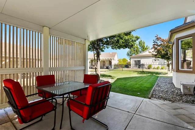 a outdoor living space with patio furniture and a garden