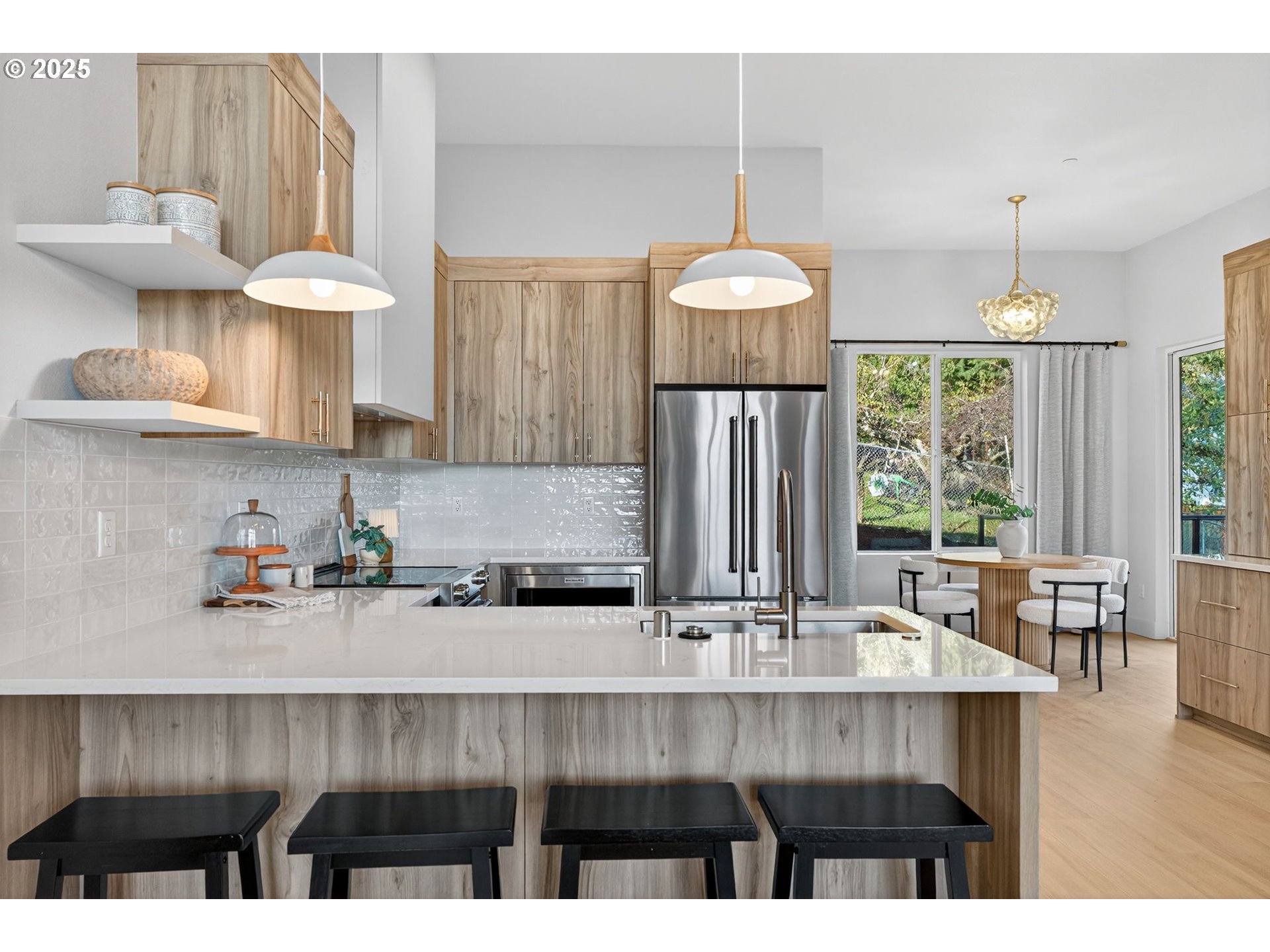 1501 Northwest 8th Avenue Camas, WA 98607 - Photo 12 of 47 a kitchen with a wooden floor and cabinets