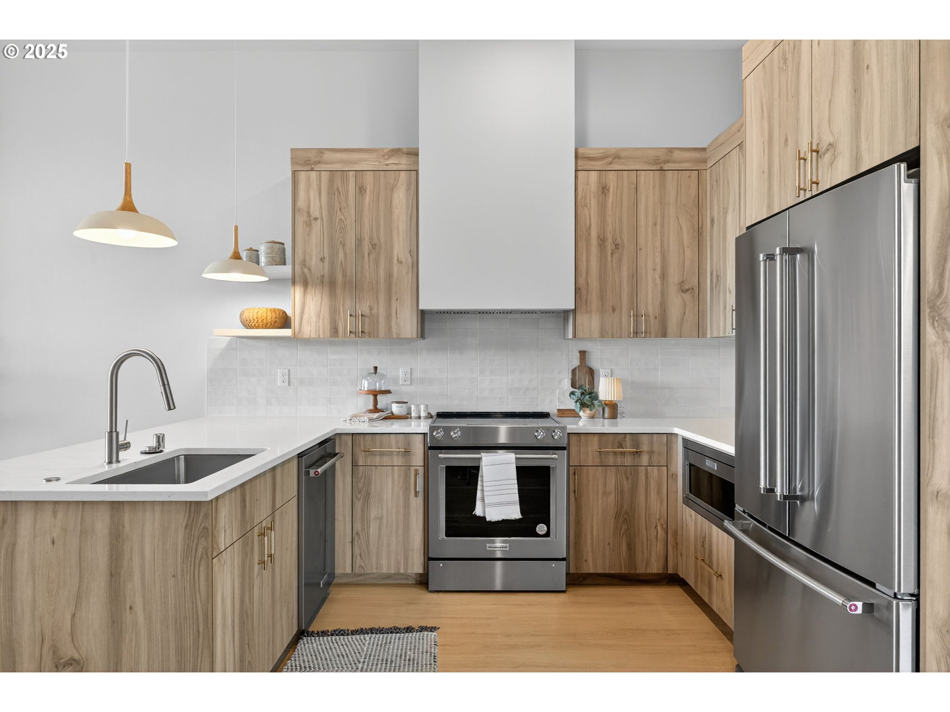 1501 Northwest 8th Avenue Camas, WA 98607 - Photo 13 of 47 a kitchen with stainless steel appliances granite countertop a refrigerator sink and stove