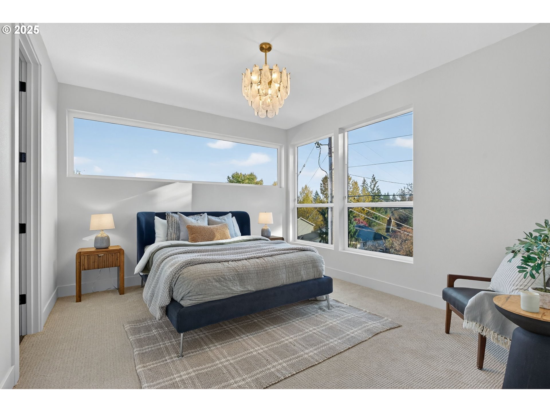 1501 Northwest 8th Avenue Camas, WA 98607 - Photo 20 of 47 a spacious bedroom with a bed a table and a potted plant