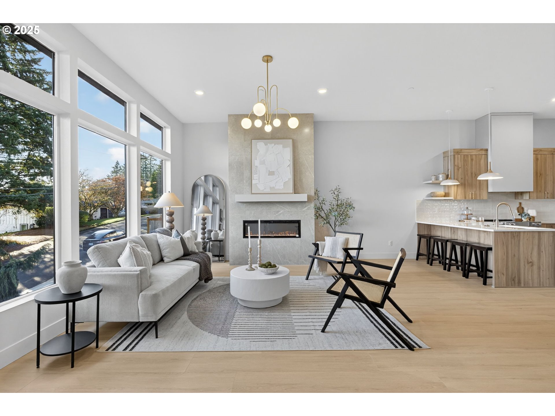 1501 Northwest 8th Avenue Camas, WA 98607 - Photo 6 of 47 a living room with furniture a dining table and a fireplace