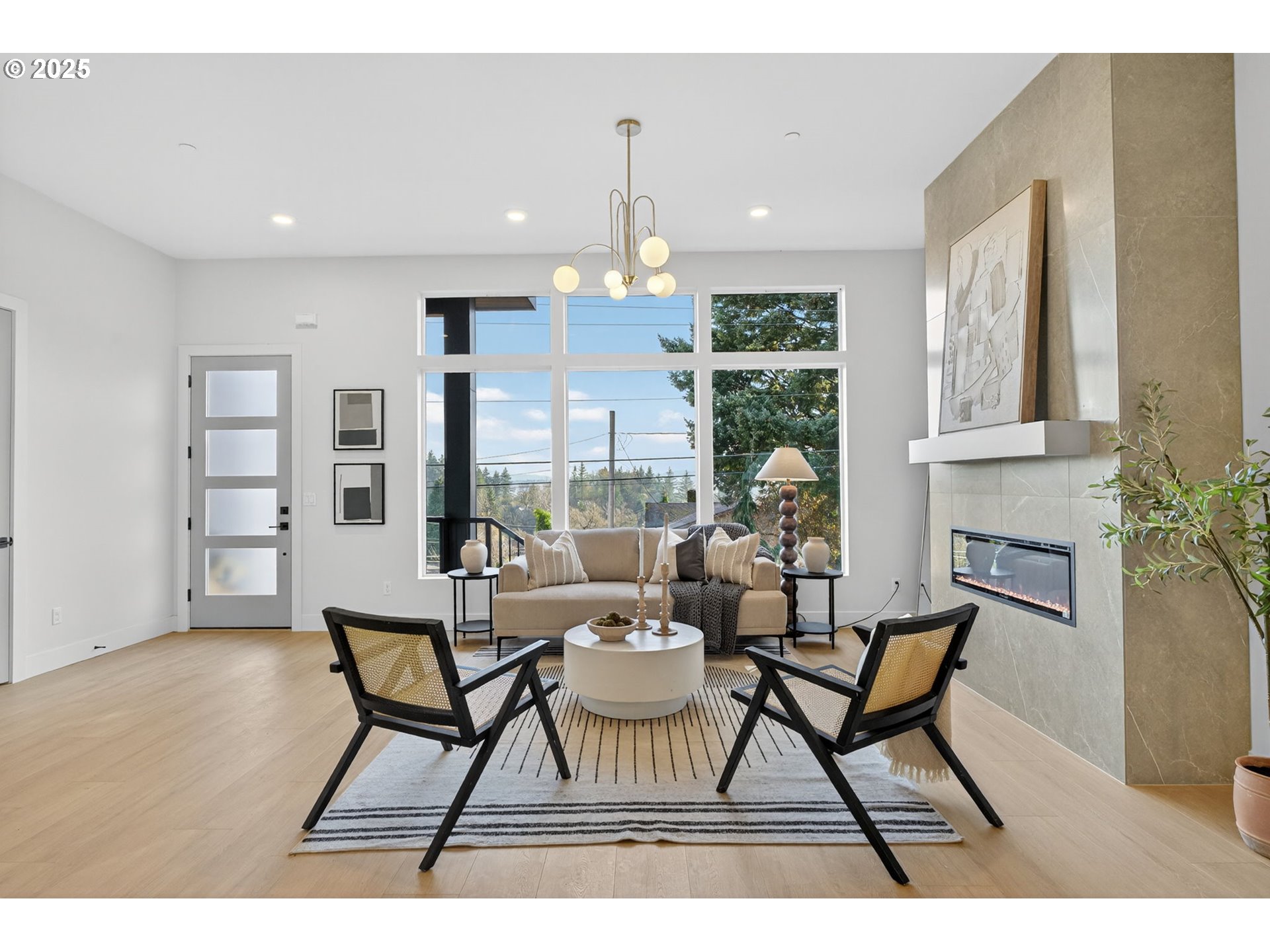 1501 Northwest 8th Avenue Camas, WA 98607 - Photo 7 of 47 a dining room with furniture a chandelier and wooden floor
