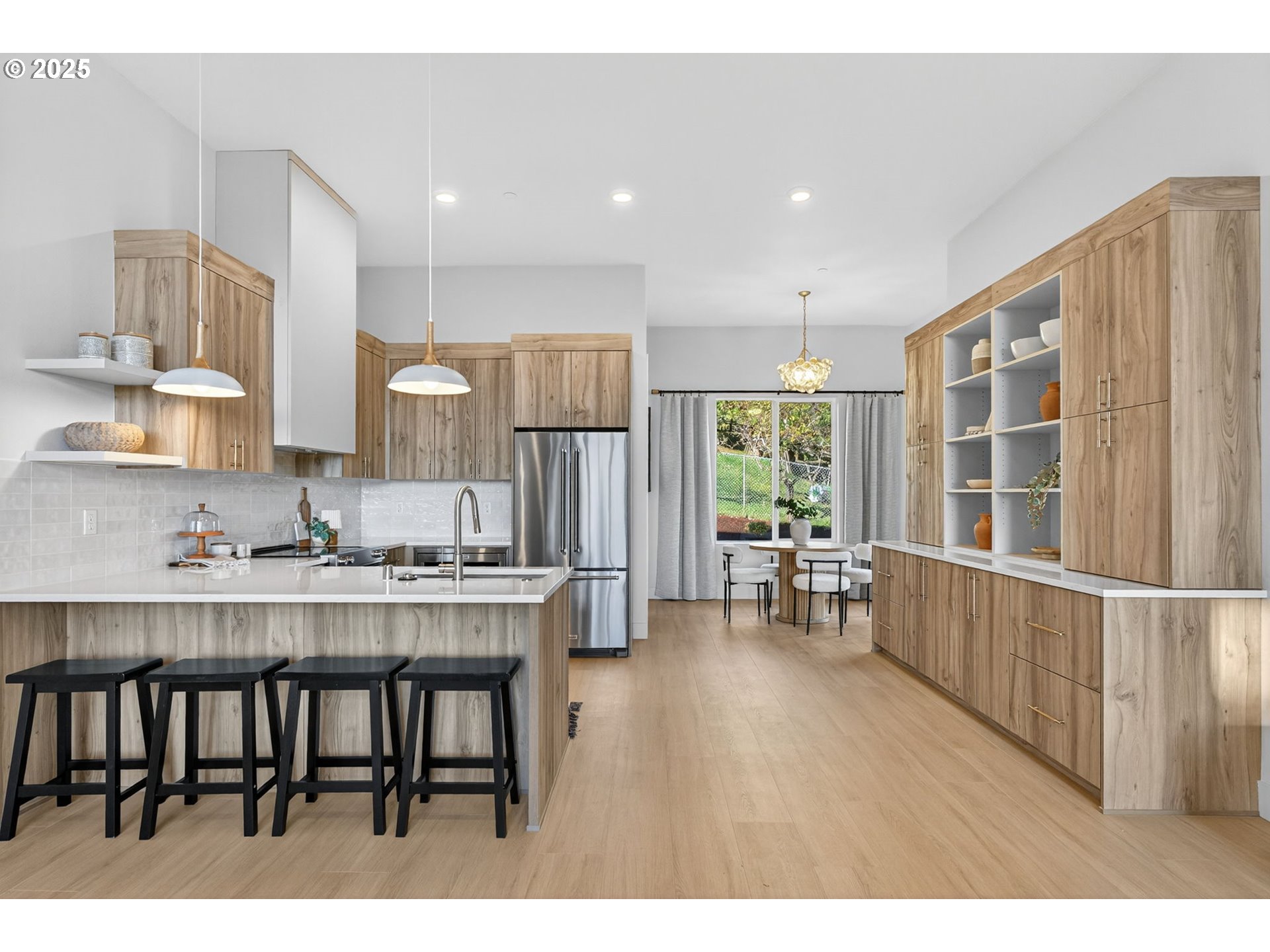 1501 Northwest 8th Avenue Camas, WA 98607 - Photo 10 of 47 a kitchen with kitchen island a dining table chairs cabinets and stainless steel appliances