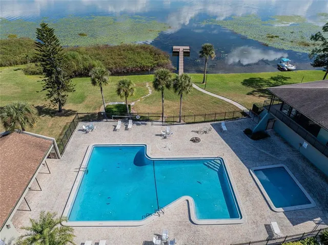 an aerial view of a house with swimming pool