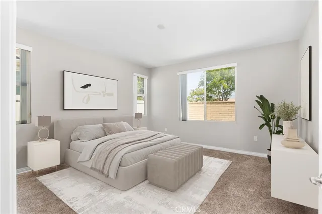 a bedroom with a bed and a mirror