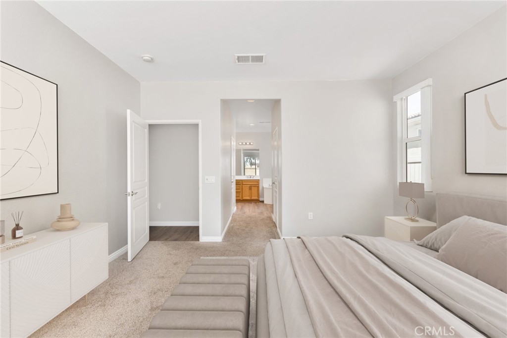 1580 Turtle Creek Beaumont, CA 92223 - Photo 12 of 39 a bedroom with a bed and a mirror