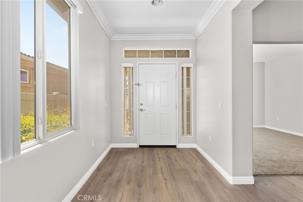1580 Turtle Creek Beaumont, CA 92223 - Photo 3 of 39 an empty room with wooden floor and windows