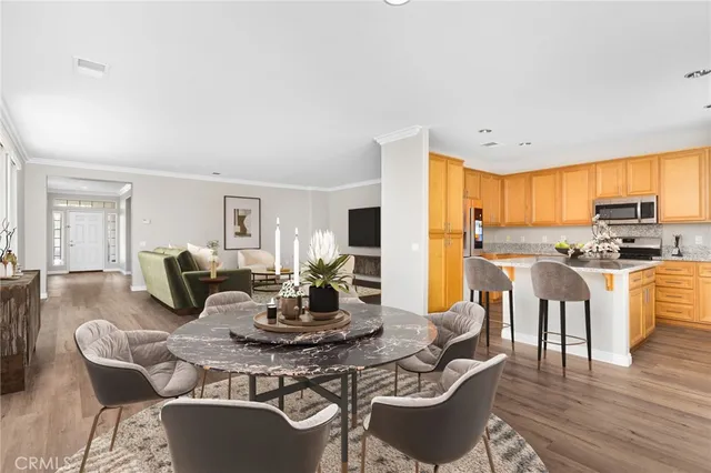 a bedroom with a large bed and a potted plant