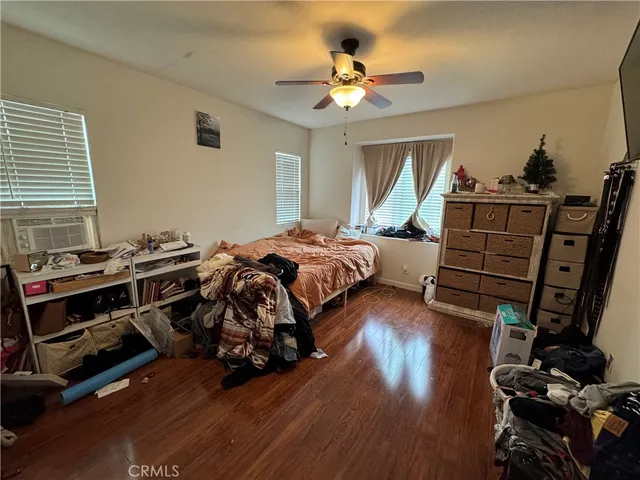 a bed room with bed and window