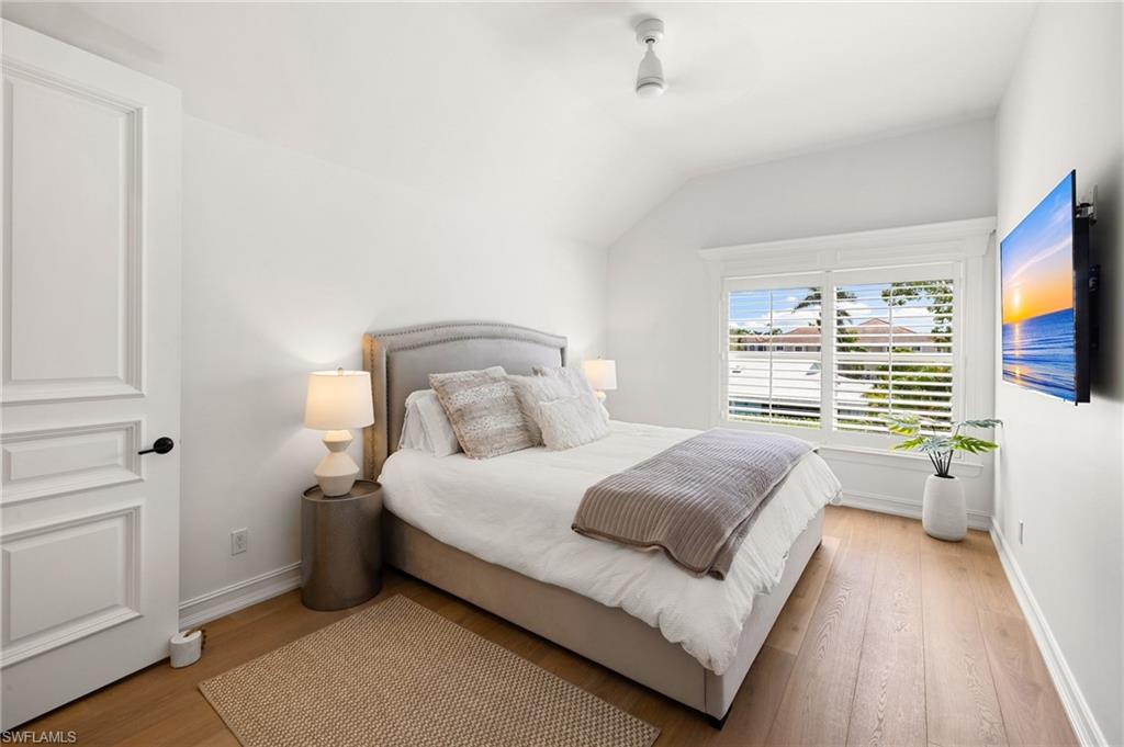 950 8th Street South Naples, FL 34102 - Photo 18 of 21 a bedroom with a bed and flat screen tv