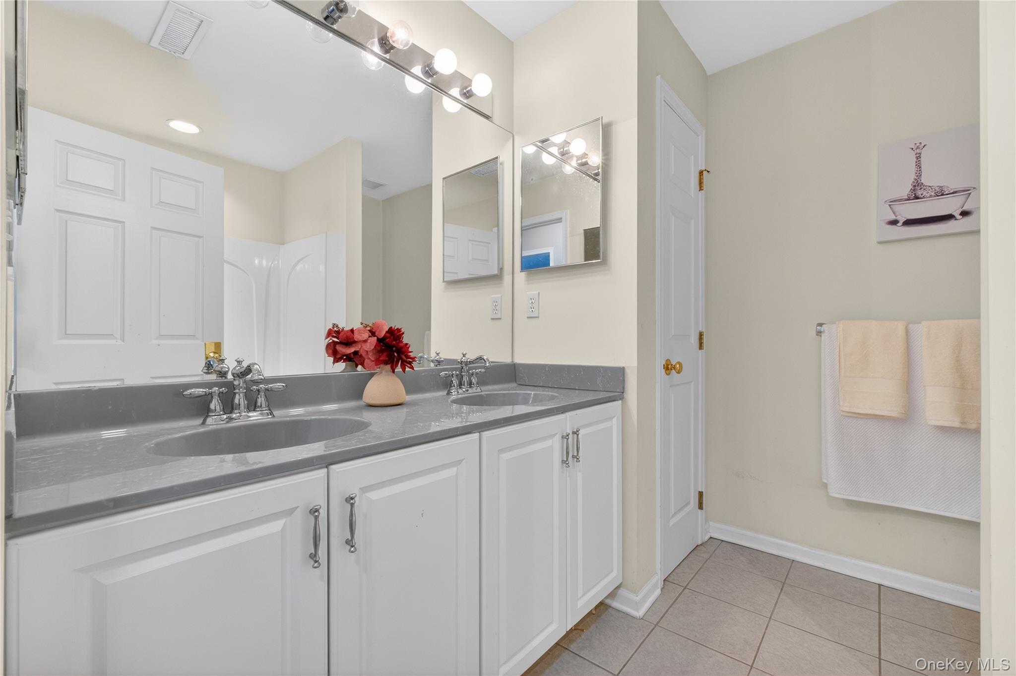 733 Huntington Drive Fishkill, NY 12524 - Photo 17 of 18 Second Full bath with double vanity and light tile patterned flooring