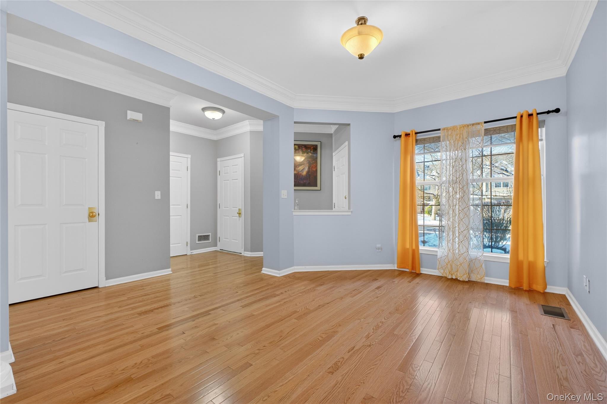 733 Huntington Drive Fishkill, NY 12524 - Photo 5 of 18 Sitting Area with light wood-type flooring and ornamental molding