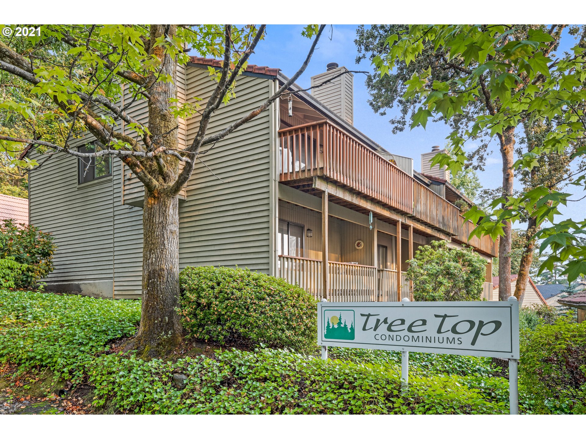 2818 Tree Top Lane West Linn, OR 97068 - Photo 1 of 26 a front view of a house with a tree