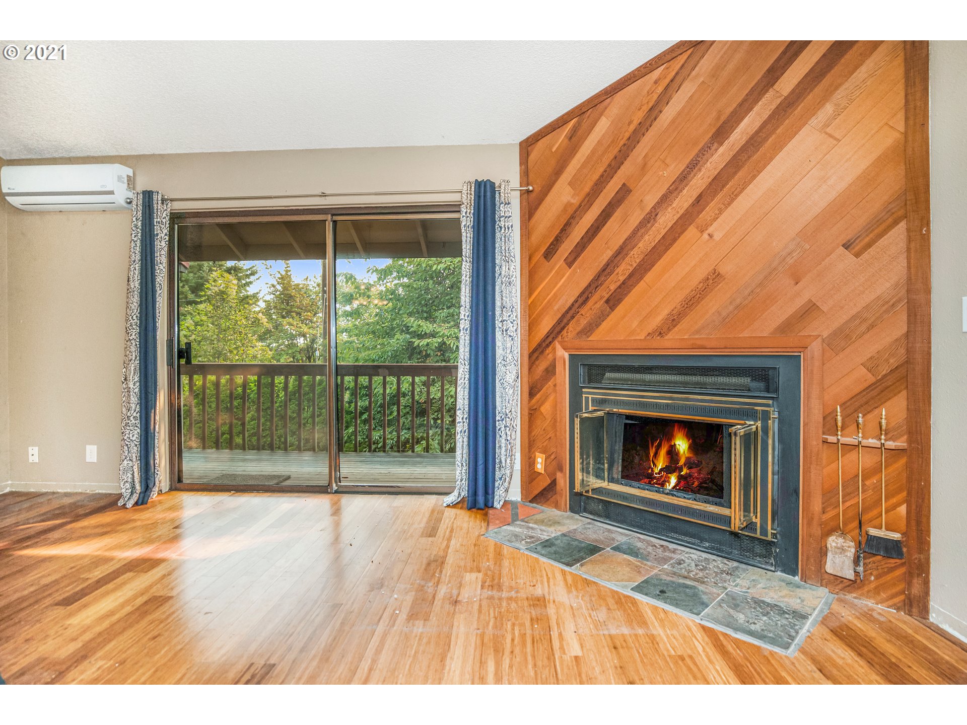 2818 Tree Top Lane West Linn, OR 97068 - Photo 14 of 26 a view of empty room with wooden floor and fireplace