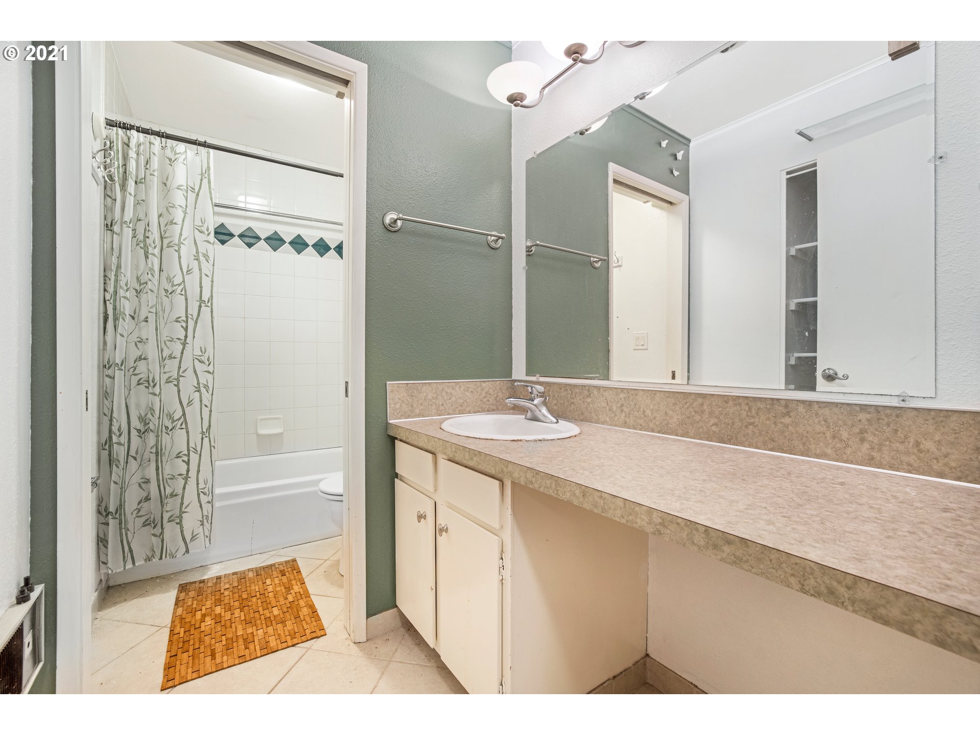 2818 Tree Top Lane West Linn, OR 97068 - Photo 21 of 26 a bathroom with a sink a mirror and a shower