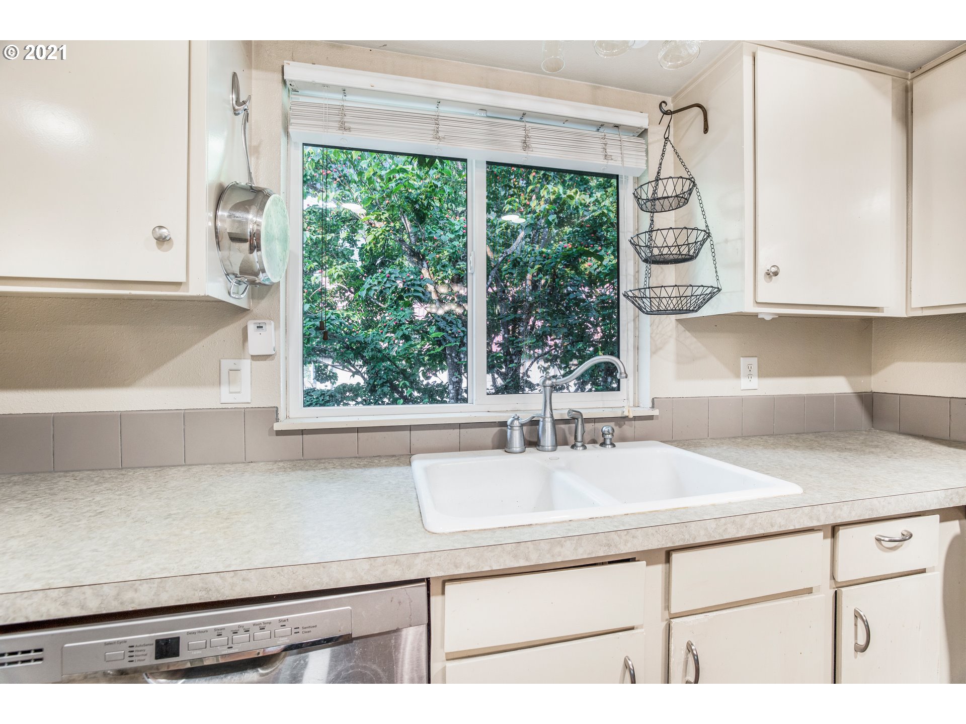 2818 Tree Top Lane West Linn, OR 97068 - Photo 9 of 26 a kitchen with a sink and a window