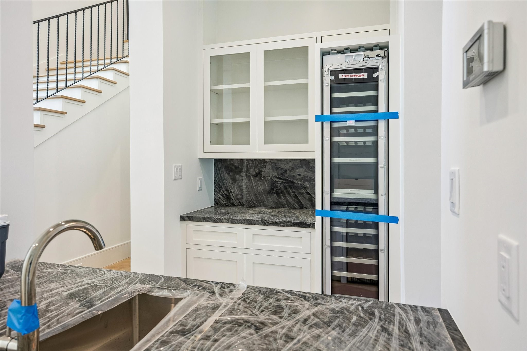 6011 Stones Throw Road Houston, TX 77057 - Photo 6 of 23 Entertainment bar – features a wine and beverage cooler, sink, and ample space for serving and entertaining. Conveniently located by the dining room.