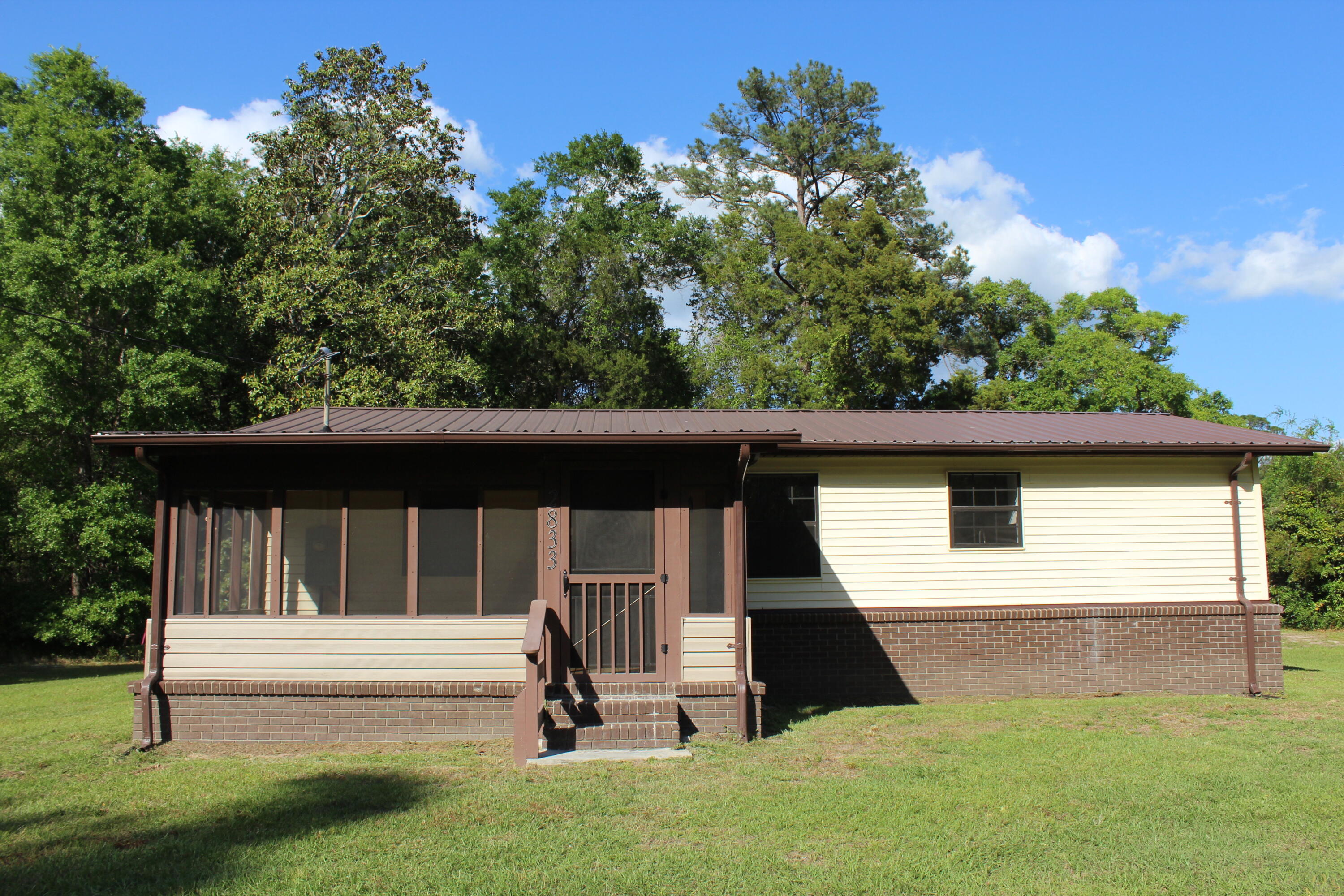 2833 Ponce De Leon Springs Road Ponce de Leon, FL 32455 - Photo 1 of 16 a front view of a house with a yard