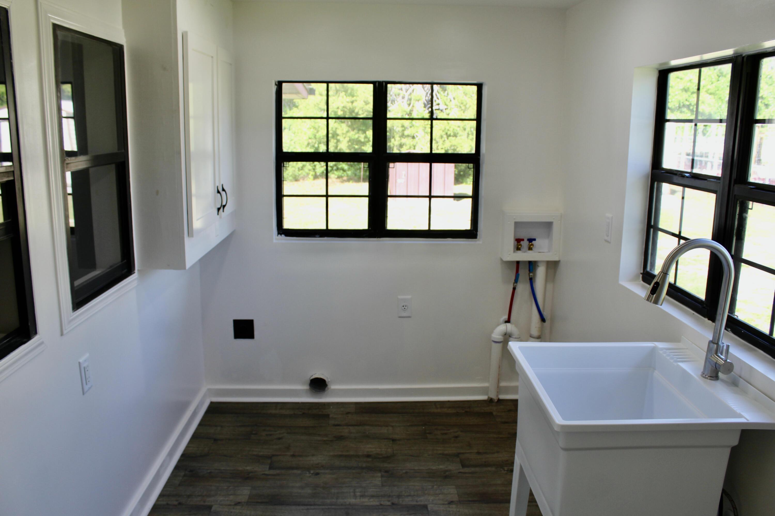 2833 Ponce De Leon Springs Road Ponce de Leon, FL 32455 - Photo 13 of 16 a view of an empty room with window and wooden floor