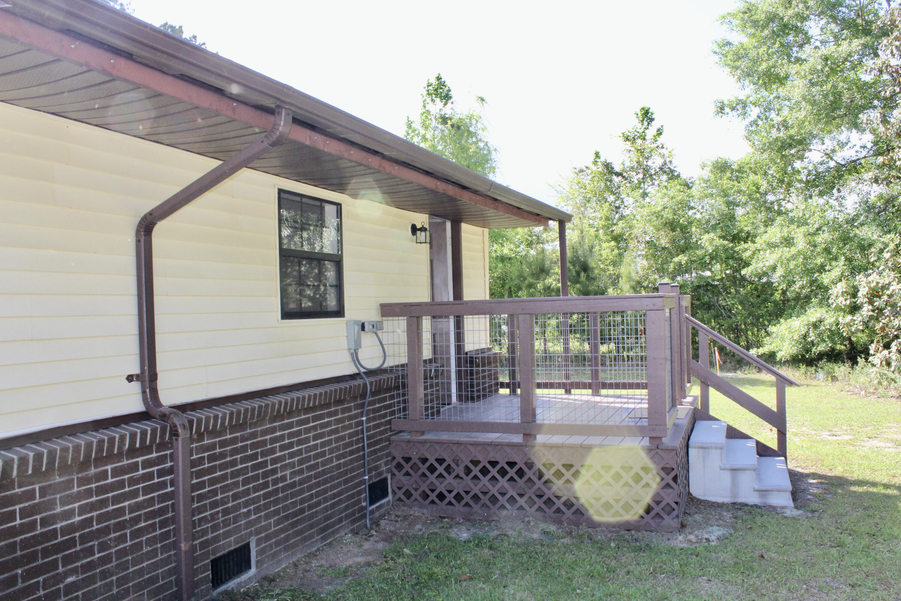 2833 Ponce De Leon Springs Road Ponce de Leon, FL 32455 - Photo 14 of 16 a view of a porch with furniture