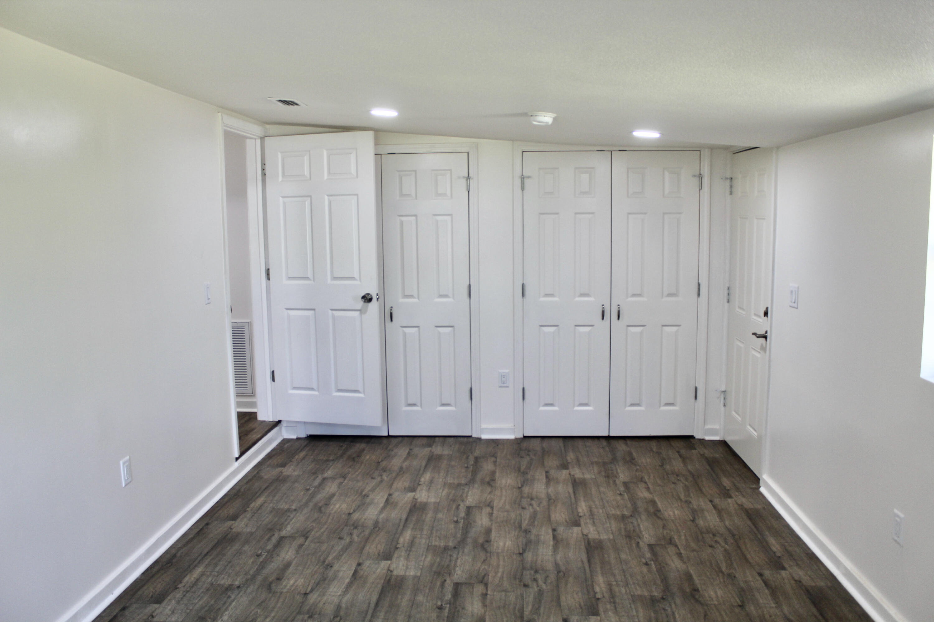 2833 Ponce De Leon Springs Road Ponce de Leon, FL 32455 - Photo 7 of 16 a view of room with hardwood floor