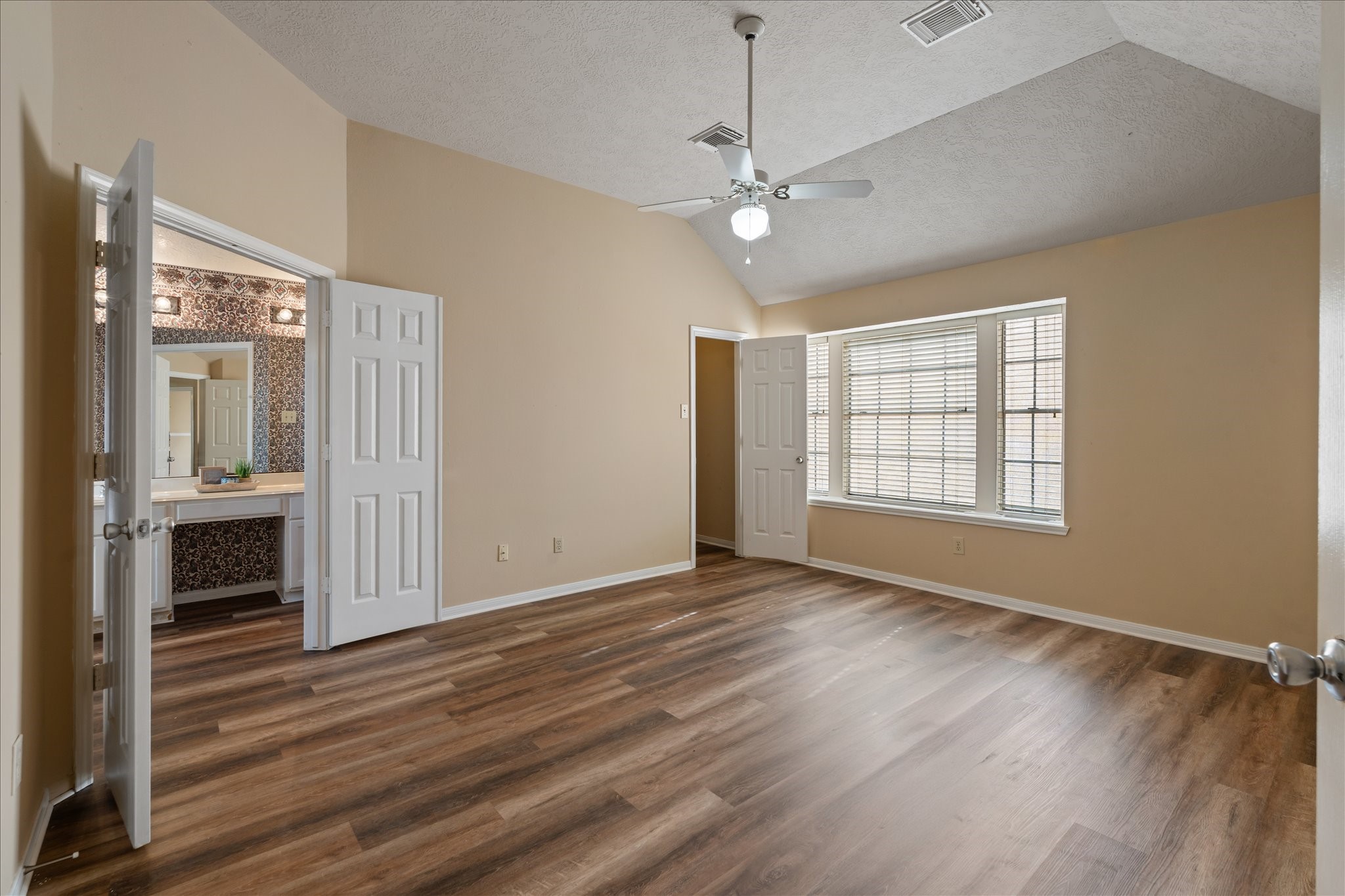 3708 Nutwood Lane Spring, TX 77389 - Photo 12 of 20 Spacious primary bedroom featuring two walk-in closets, offering comfort, storage, and a private retreat.