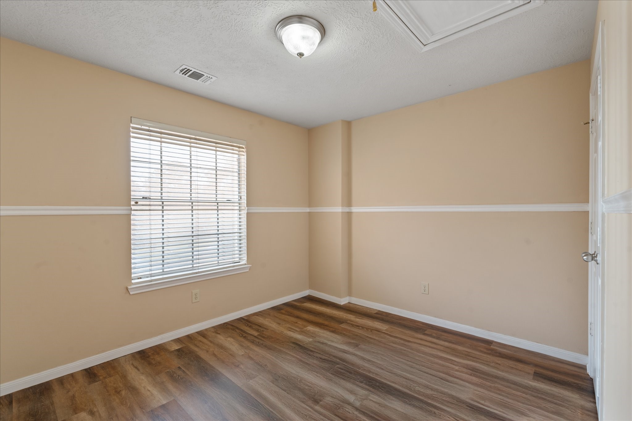 3708 Nutwood Lane Spring, TX 77389 - Photo 16 of 20 Bright secondary bedroom with plenty of space and a large closet, perfect for family or guests.