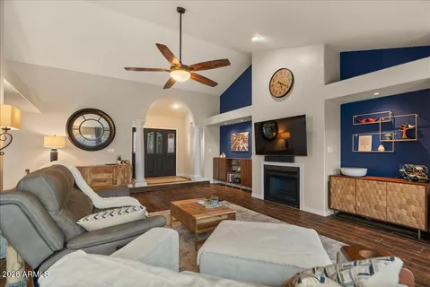 a kitchen with a table chairs refrigerator and cabinets