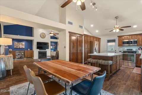 a kitchen with a stove a sink and a refrigerator
