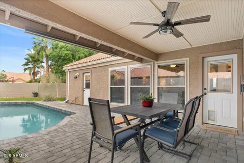 a house view with a bench and chairs
