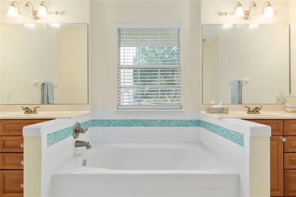 a kitchen with stainless steel appliances granite countertop a stove a refrigerator and a sink with granite countertops