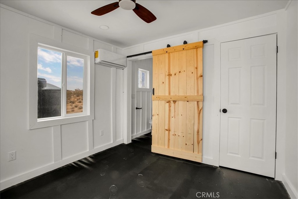 777 Quail Bush Road Landers, CA 92285 - Photo 13 of 46 a view of an entryway with wooden floor