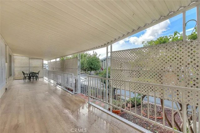 a view of a balcony with chairs
