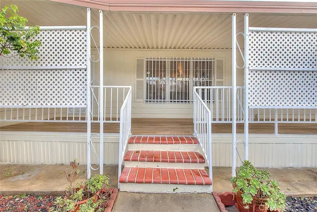 a view of a balcony with a potted plant