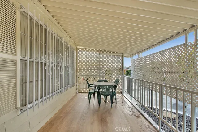 a view of hallway with wooden floor