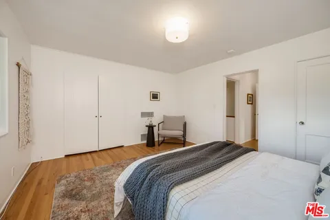 a view of backyard of house with outdoor seating